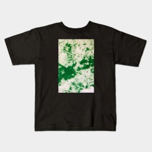 Green felt disbursed on a white surface Kids T-Shirt